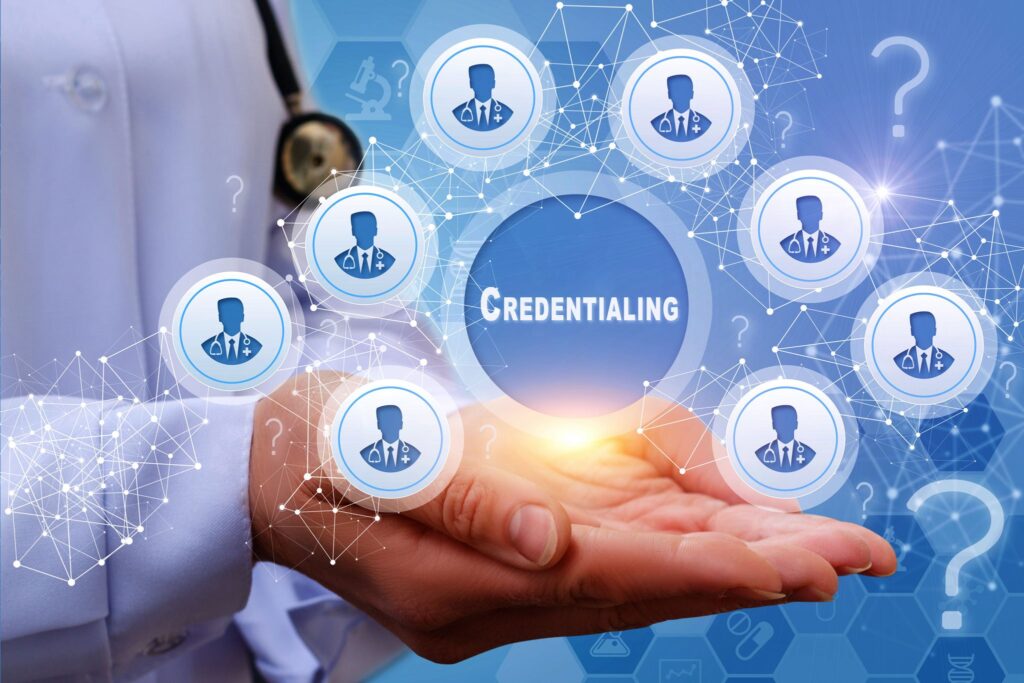 Who verifies professional information in credentialing process?