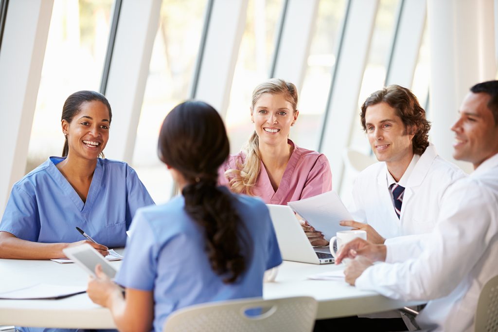 Who awards hospital privileges to physicians?